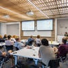 Individuals viewing presentation in classroom